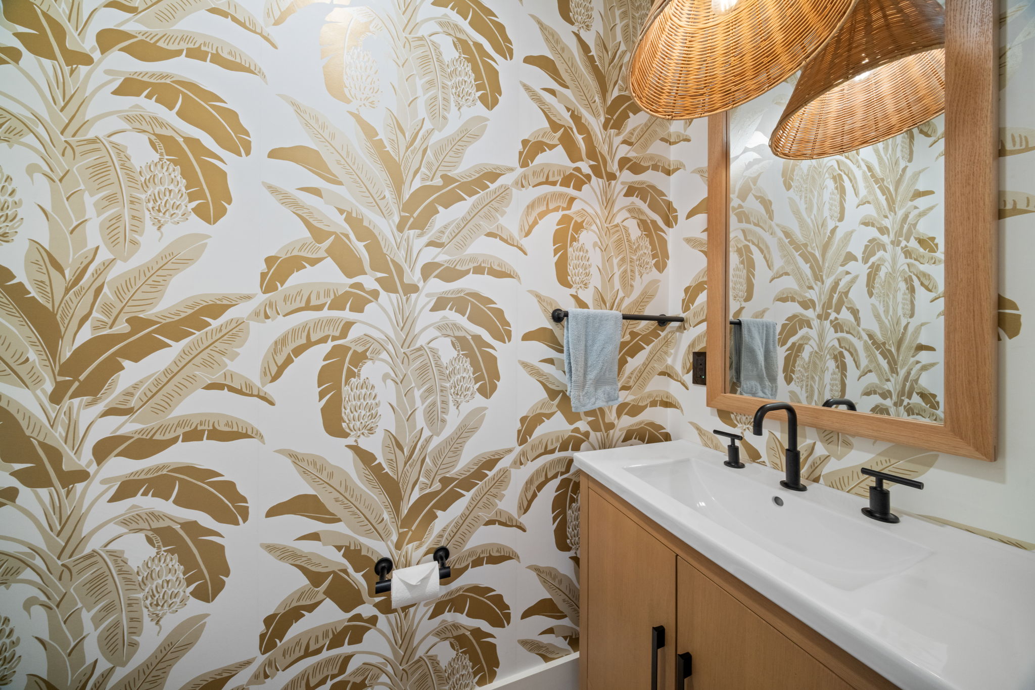 Powder room with tropical wallpaper