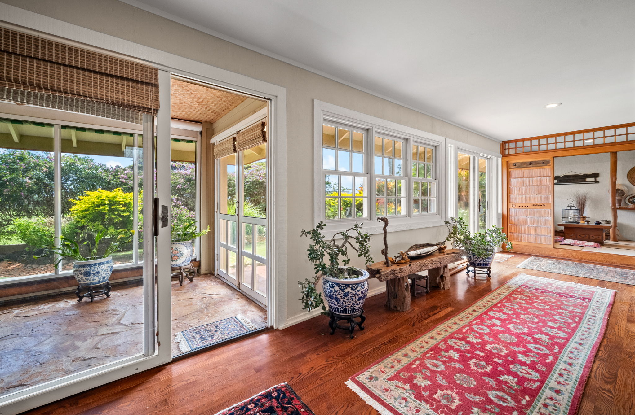 Primary suite sitting area with garden views