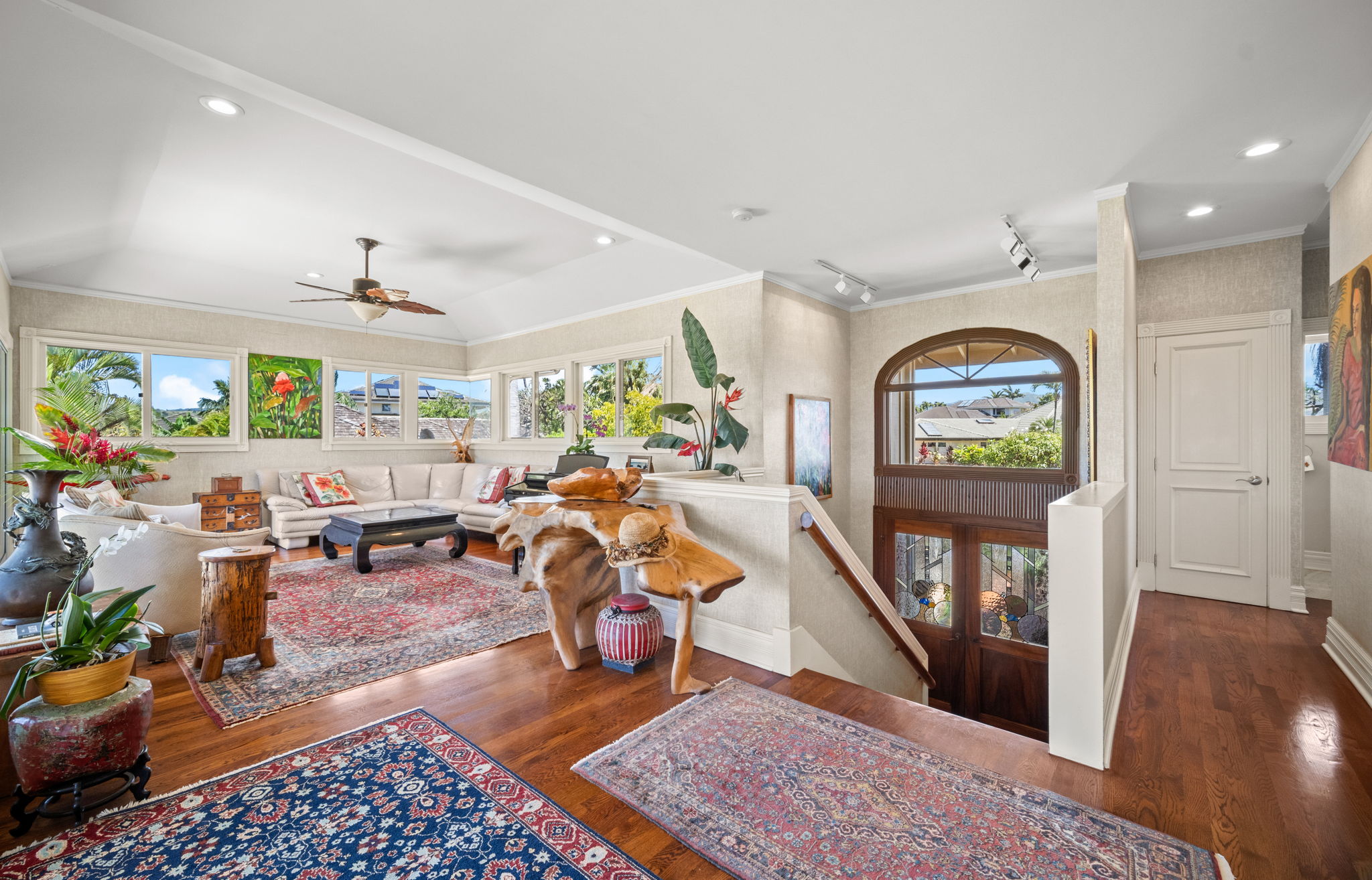 Upper living room with lush garden views