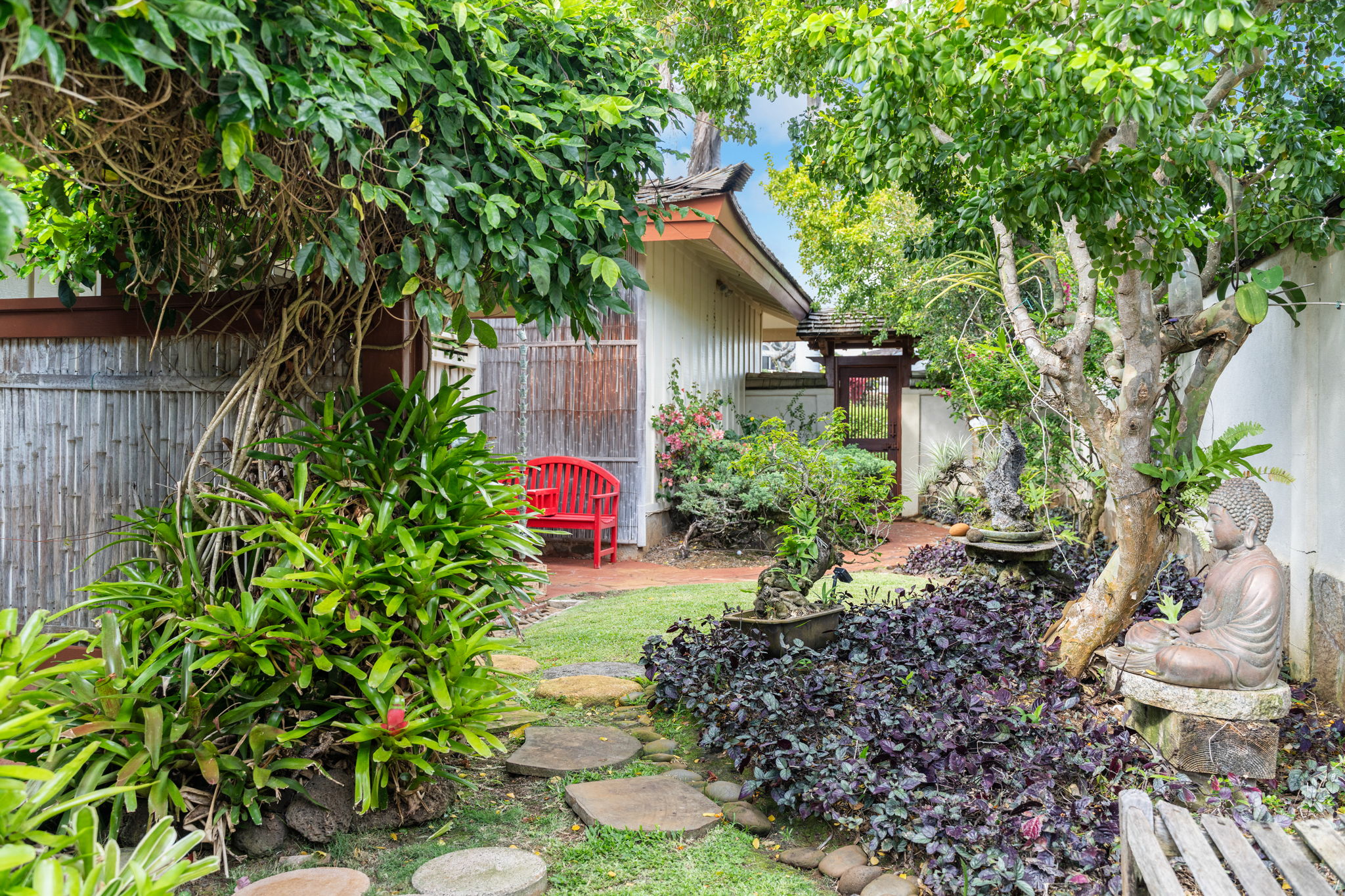 Zen garden with Buddha sculpture