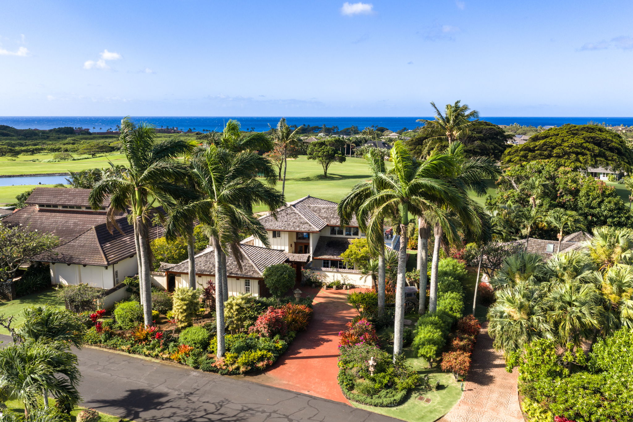 Aerial view of 2661 Puuone St with Kiahuna Golf Course and Pacific Ocean